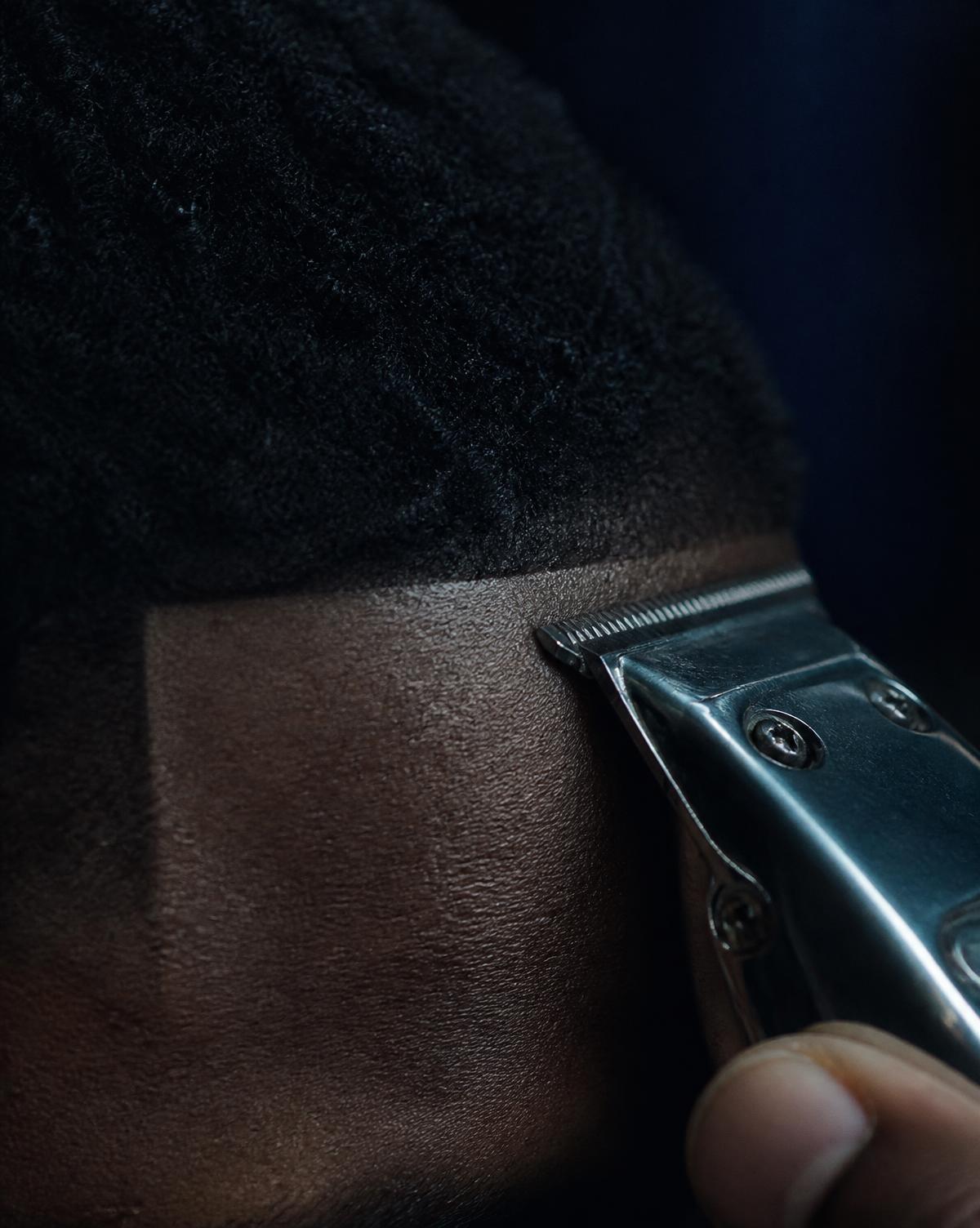 Detail of a sharp hairline being maintained with a trimmer